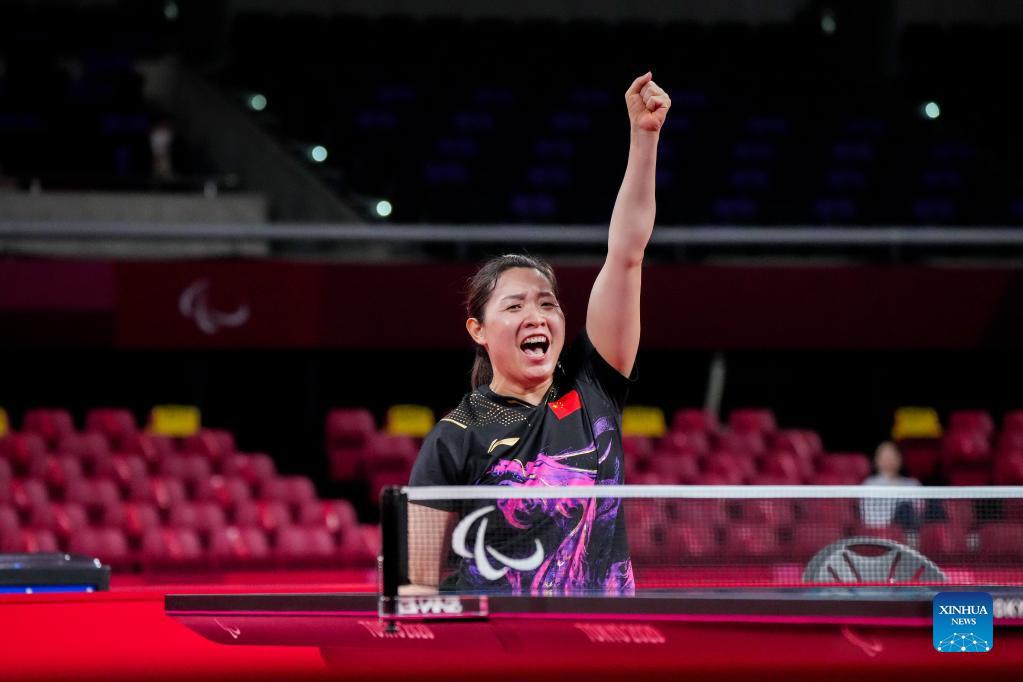 Zhang Bian celebrates victory after the women's singles class 5 final of table tennis