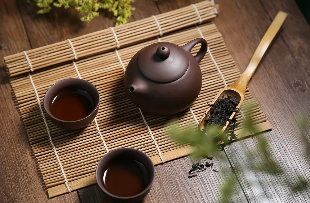 tea-water-brown-background-pottery